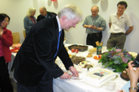 Dr Broadhurst cuts the cake